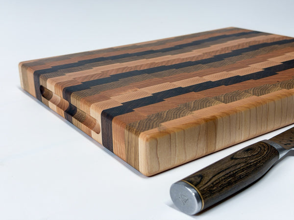 Waverley four-wood end grain cutting board - top-down flat lay