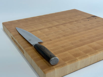 Top view of XXL maple end grain cutting board with chef's knife — 24x20 butcher block by Ottawa Lumber Bin