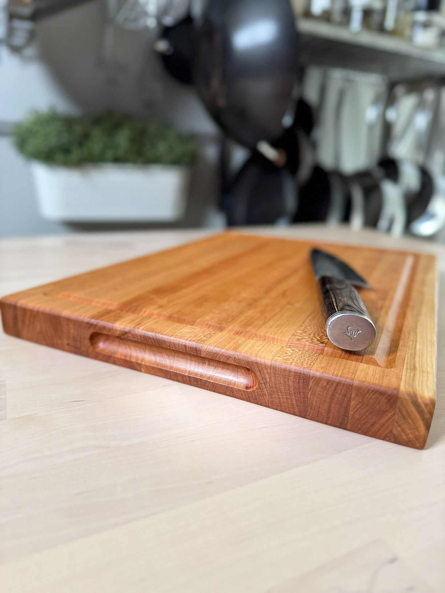 Cherry edge grain cutting board flat lay with knife, handmade hardwood Ottawa