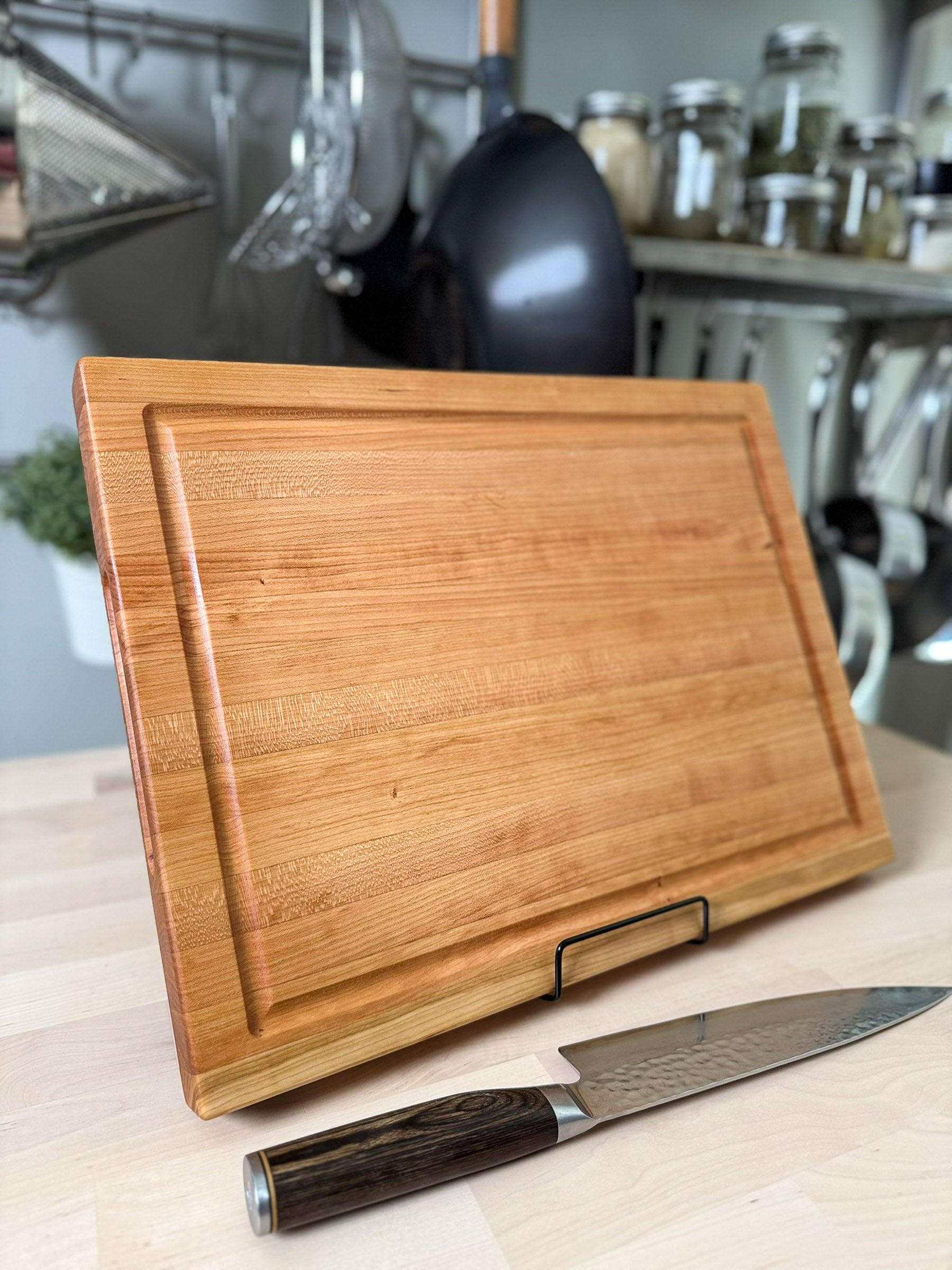 Cherry edge grain cutting board handmade in Ottawa, with juice groove and handle slot