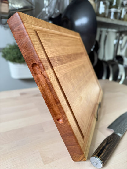 Side profile of handmade cherry edge grain cutting board Ottawa Lumber Bin