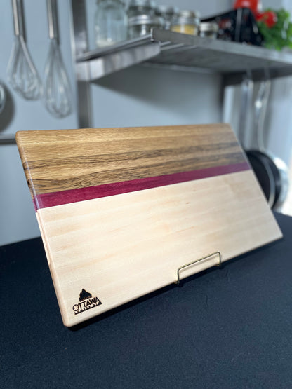 Handcrafted edge grain charcuterie board made from maple, black limba and Purpleheart.
