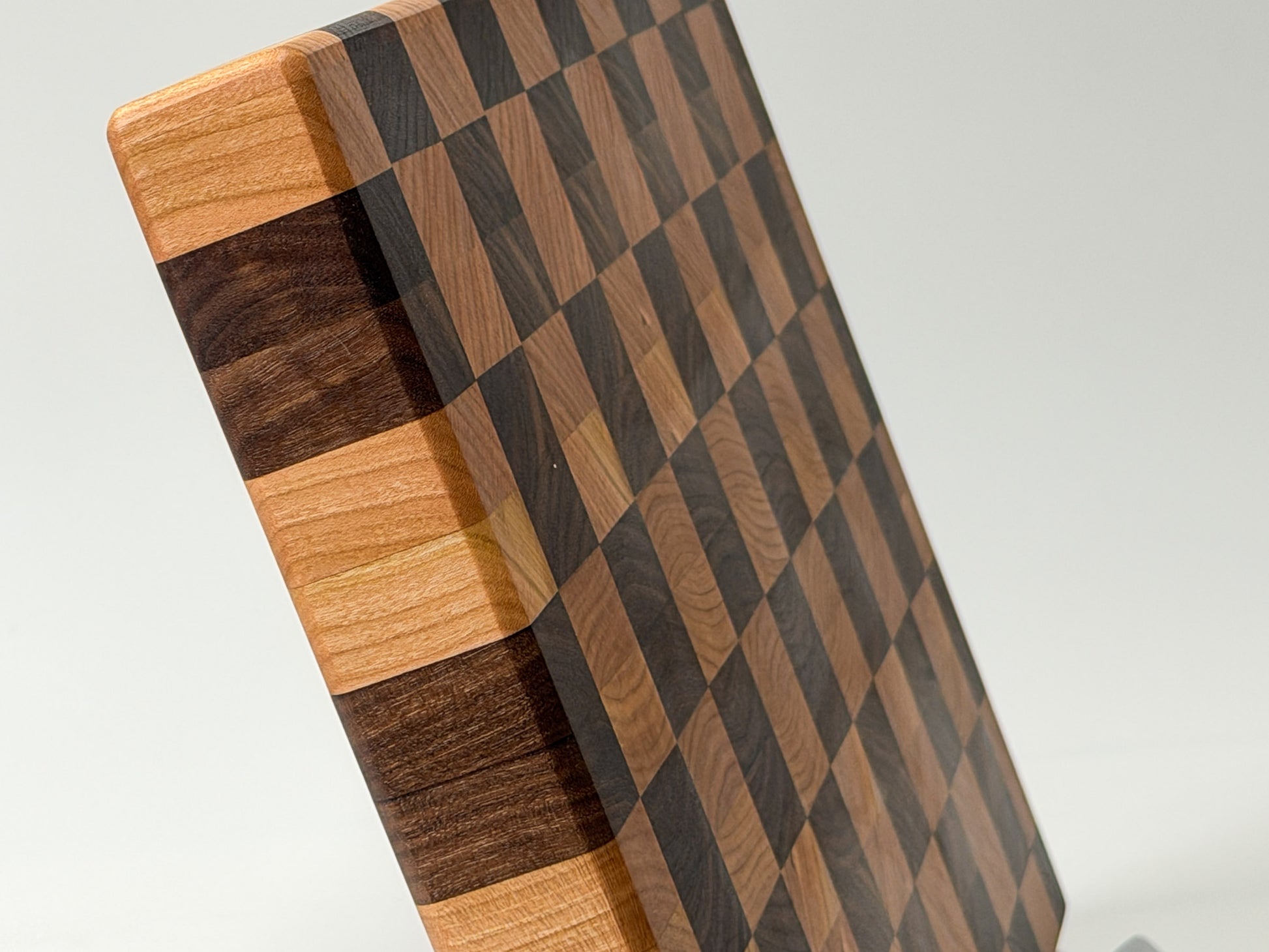 Corner close-up of end grain butcher block showing checkerboard hardwood pattern, handmade Ottawa