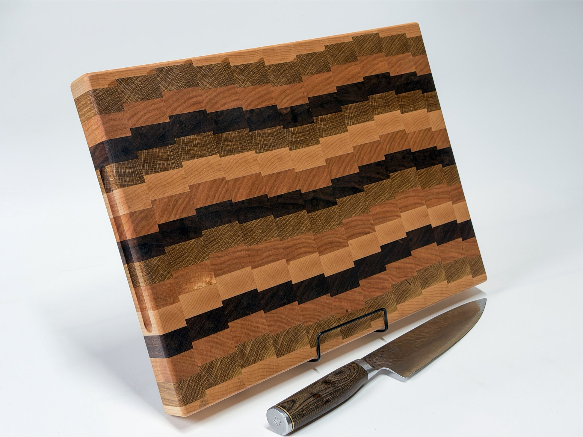 Low angle shot of end grain butcher block with knife, handmade hardwood Ottawa Lumber Bin