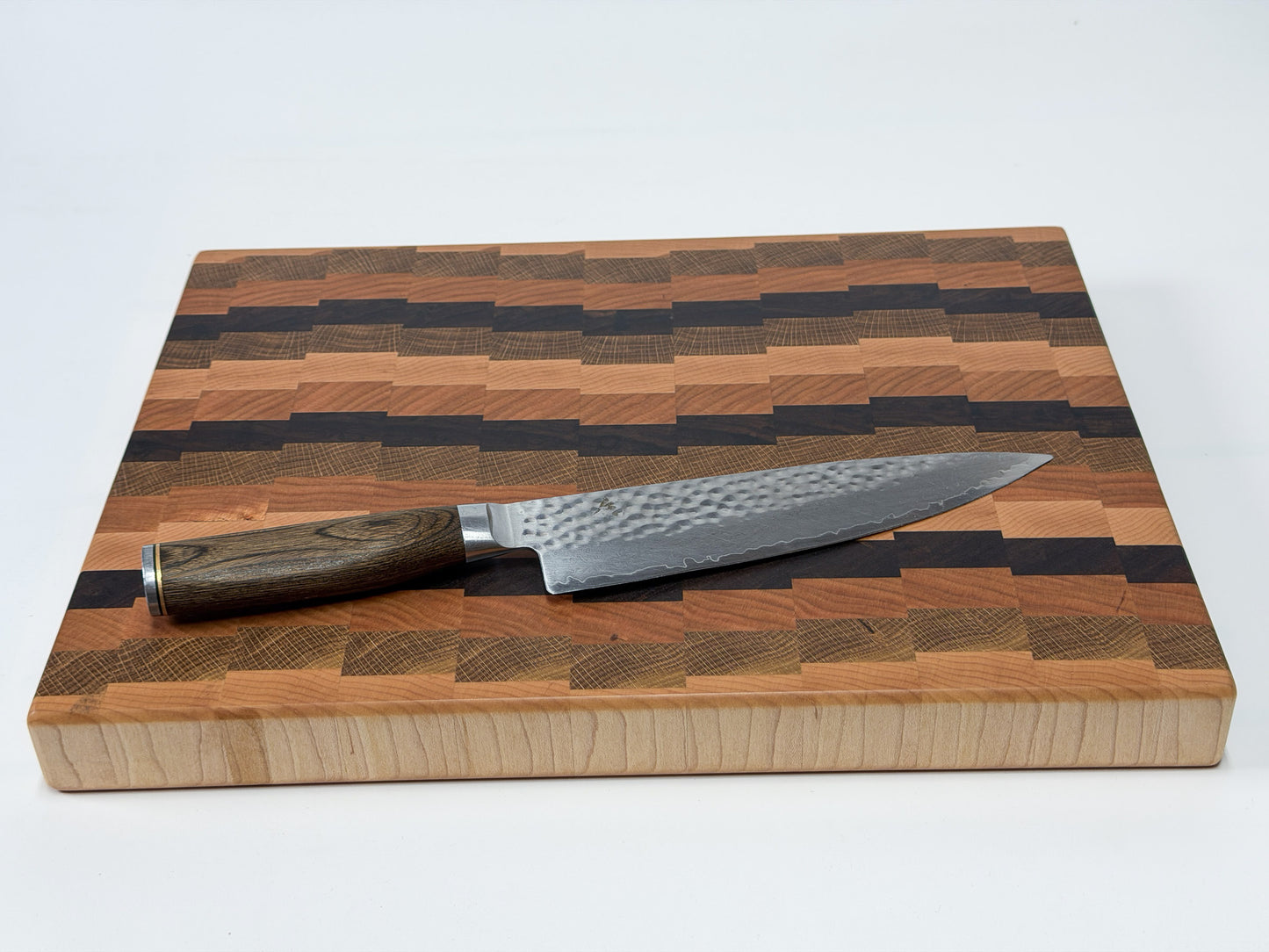 End grain butcher block standing upright showing mixed hardwood stripe pattern, Ottawa Lumber Bin