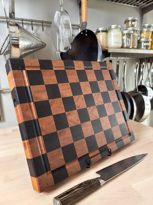 Handmade end grain butcher block standing upright with knife, mixed hardwood Ottawa Lumber Bin