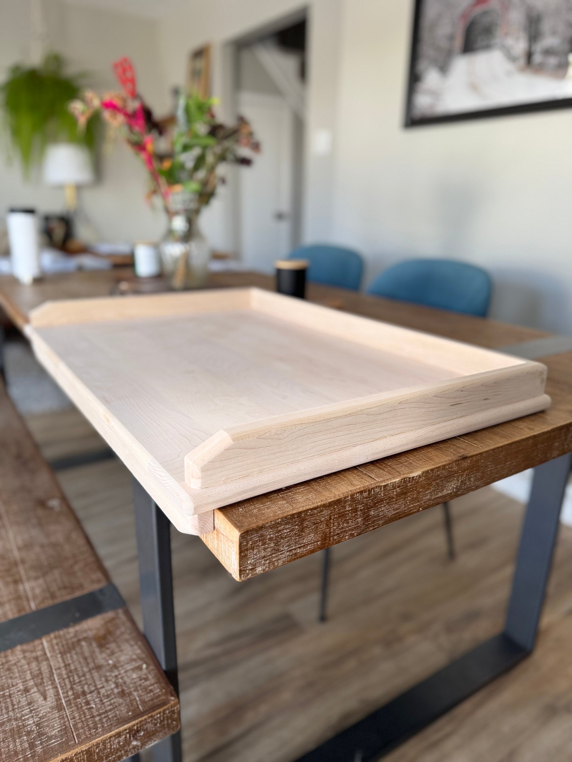 Maple pierogi board displayed on side view to show the edges of the board
