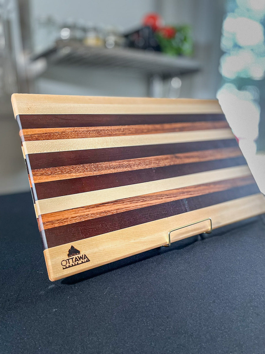 Edge-grain cutting board handcrafted from maple, walnut and tigerwood.
