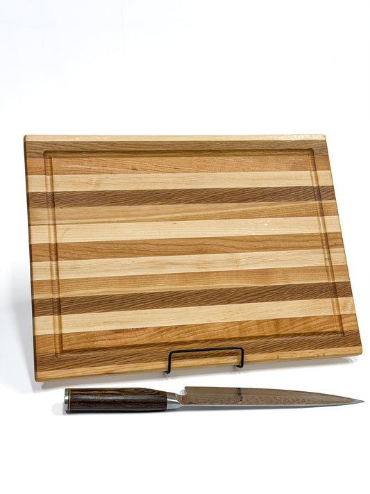 Maple, white oak and cherry edge grain cutting board handcrafted from alternating hardwood strips