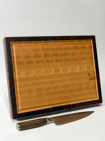 Handmade walnut and maple end grain cutting board standing upright, Ottawa Lumber Bin